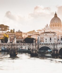 Scenic European river with historic bridge and cathedral architecture